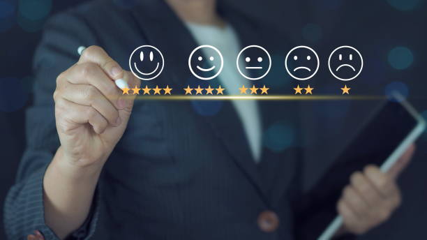 istock Businessman pressing smiley face emoticon on virtual touch screen. Customer service evaluation concept. 2196199266