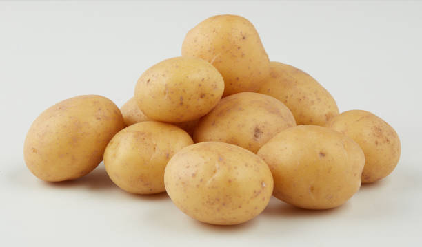 istock fresh potatoes isolated nature background with clipping path 2196199368