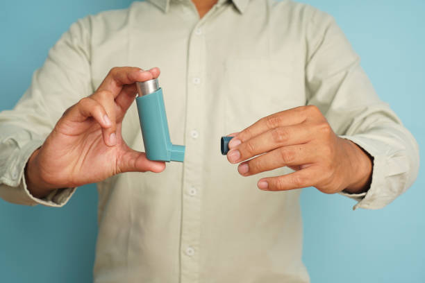istock Close up man holding inhaler for astma patient 2196200766