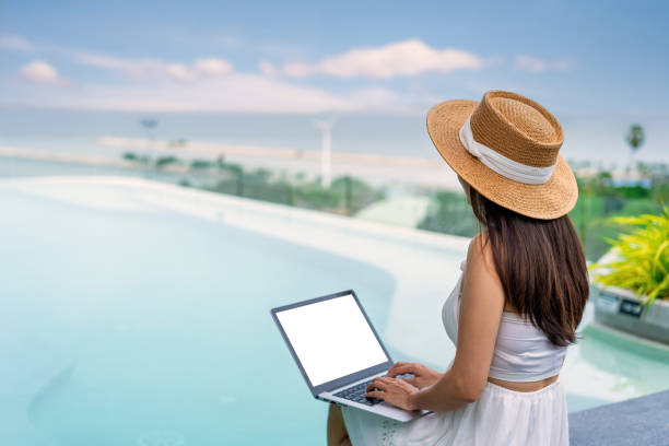 istock Young woman freelancer traveler working online using laptop while traveling on summer vacation, Freelance and workation concept 2196202595