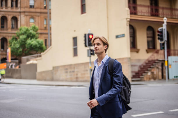 istock Business professional navigating busy streets in Sydney, Australia during a workday 2196203960