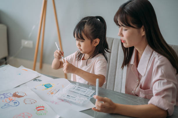 istock Drawing Together: A Heartwarming Moment in the Living Room 2196203976