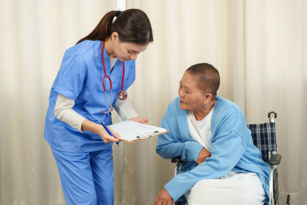 istock Nurse discussing patients condition with elderly woman during home care session. Emphasizing personalized healthcare, clear communication, and compassionate support for recovery. 2196204143