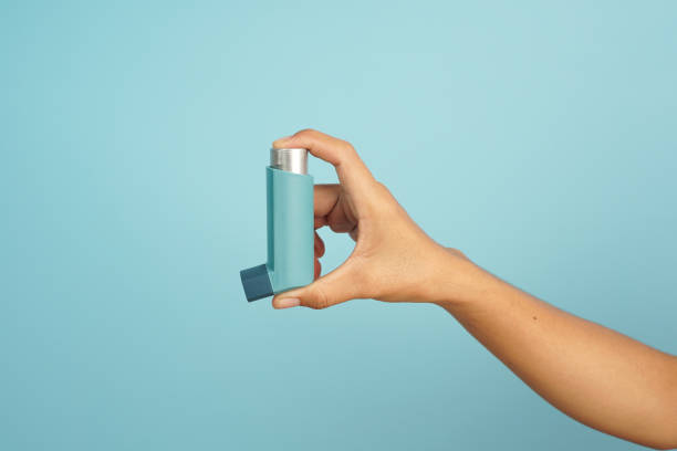 istock Hand hold aerosol spray inhaler 2196208119