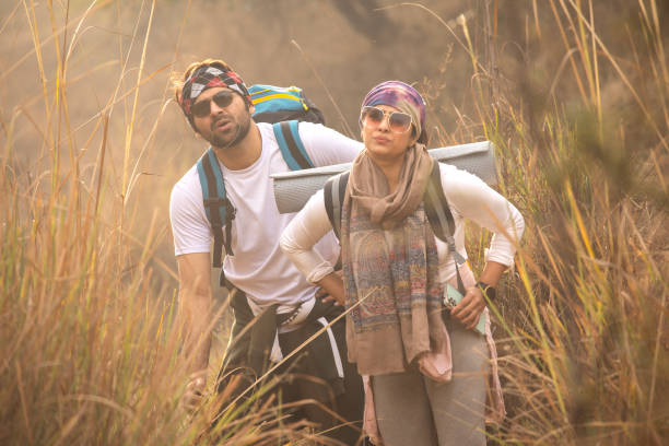 istock Tired young couple standing and resting in forest 2196216016