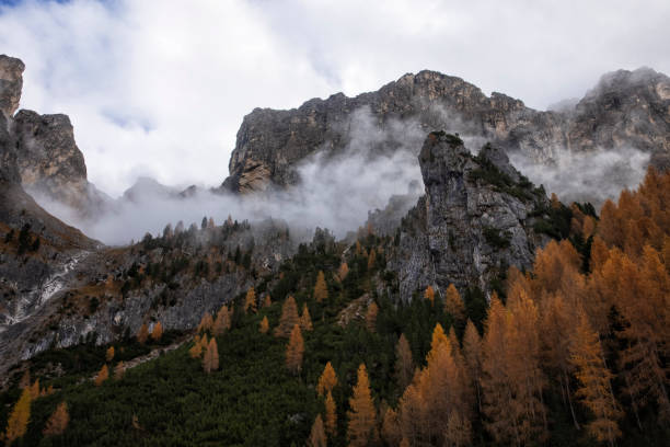 Dolomites view on a misty morning in autumn, Italy.
