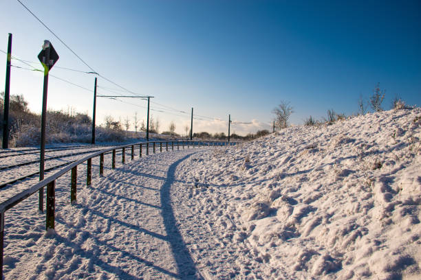 istock Slushy snow on a footpath; the day after a heavy snowfall. 2196218127