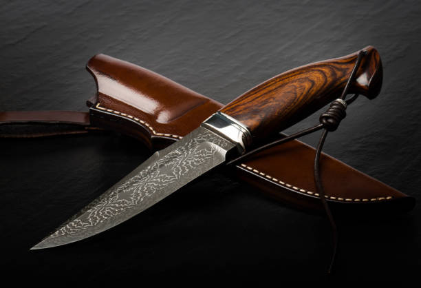 istock Hunting knife handmade on a black background. 2196220106