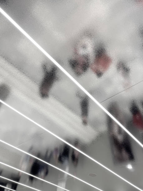 istock A blurry image of people walking in a hallway with a silver 2196220697