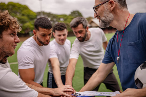 istock Men collaborate and strategize during a soccer practice session in Sydney, showcasing teamwork and competitive spirit 2196220890