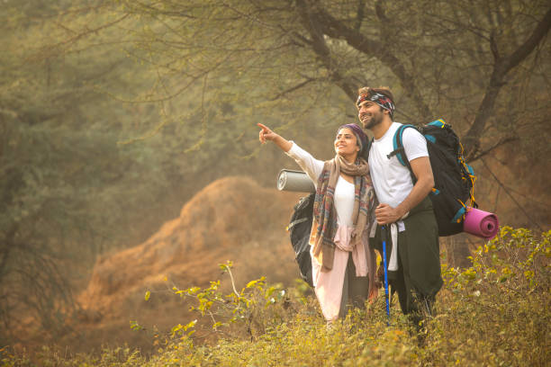 istock Young couple hiking in forest 2196222370