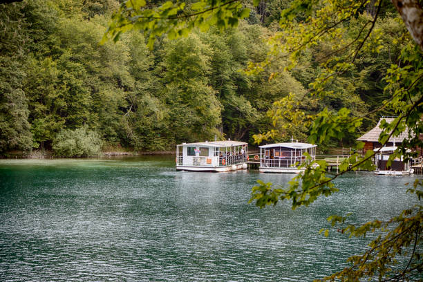 Small harbor at Plitvice lakes, Croatia. Pure blue water in lakes, wooden harbor.