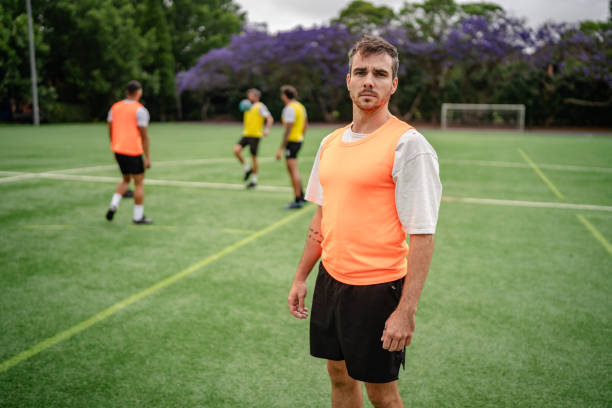 istock Men practice soccer on a sunny Sydney field, showcasing teamwork and happiness during training 2196224616