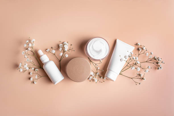istock White cosmetic containers and gypsophila flowers 2196225139
