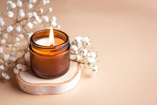 istock Burning candle and white gypsophila flowers 2196225274