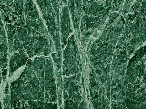 istock Real closeup of dark green marble stone texture surface background. Design pattern with high resolution for luxury home decoration. Abstract matt slab rock material. Front view of natural tiles stone surface. 2196227665