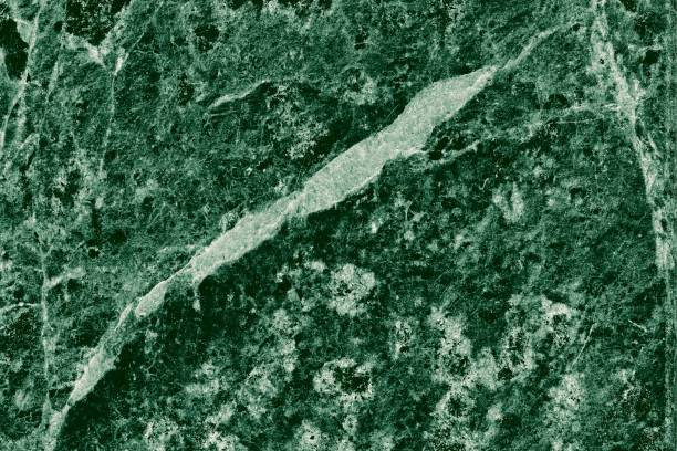 istock Real closeup of dark green marble stone texture surface background. Design pattern with high resolution for luxury home decoration. Abstract matt slab rock material. Front view of natural tiles stone surface. 2196227685