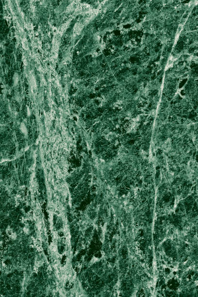 istock Real closeup of dark green marble stone texture surface background. Design pattern with high resolution for luxury home decoration. Abstract matt slab rock material. Front view of natural tiles stone surface. 2196227690