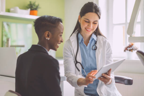istock Doctor consulting her patient 2196227788
