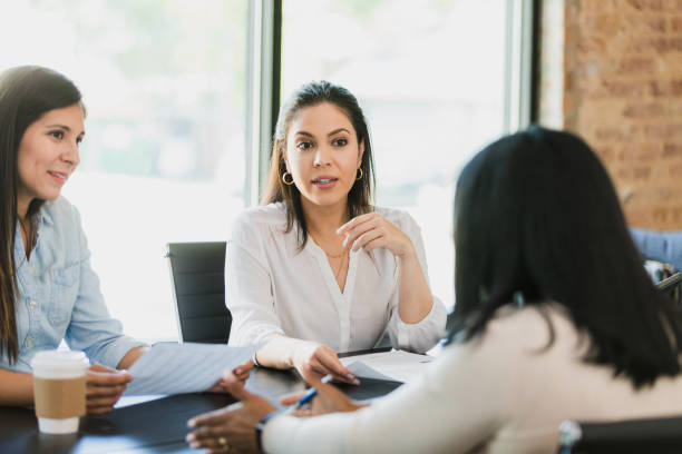 istock Three Diverse Women in Business Meeting, Teamwork and Discussion 2196229530