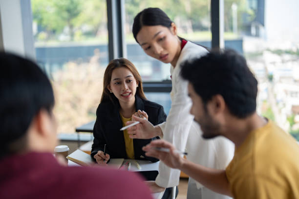 istock Group of colleagues entering a meeting room for a brainstorming session 2196231079