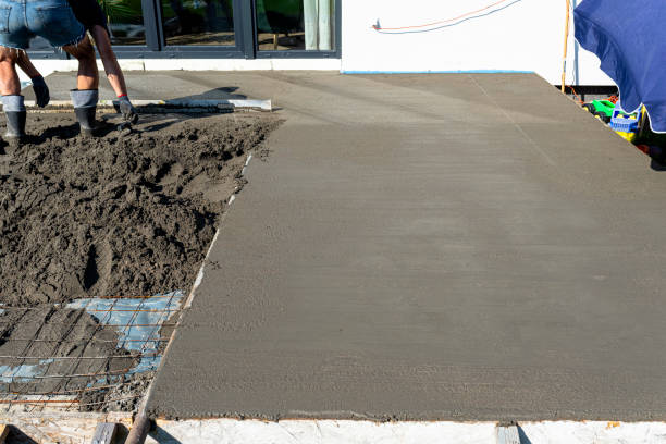 istock Pouring handmade concrete on to a home terrace covered with reinforcement. 2196231834