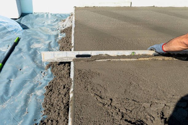 istock Pouring handmade concrete on to a home terrace covered with reinforcement. 2196232203