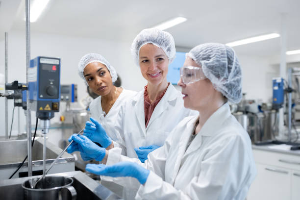 istock A group of women workers in biochemical pharmaceutical production 2196233556