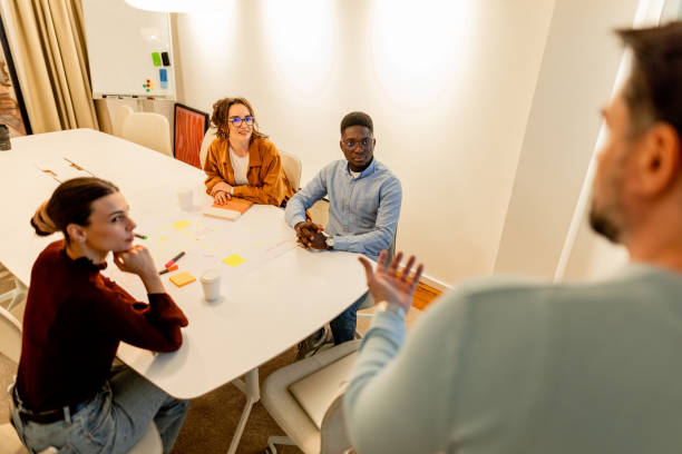 istock Diverse team brainstorming during a meeting in a modern office 2196235494