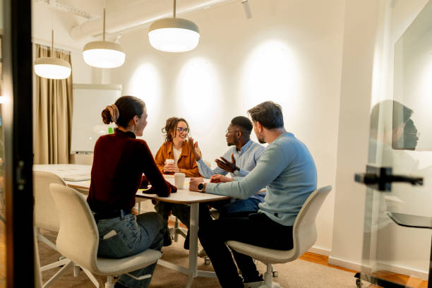 istock Diverse Business Team Collaborating on Project in Modern Office Meeting Room 2196235531