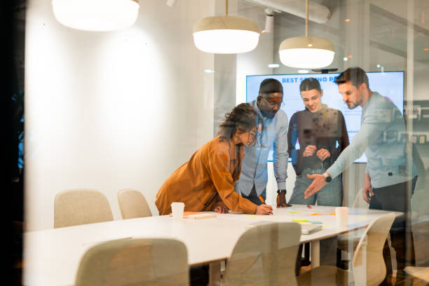 istock Marketing team working together on a new strategy in the office 2196235593