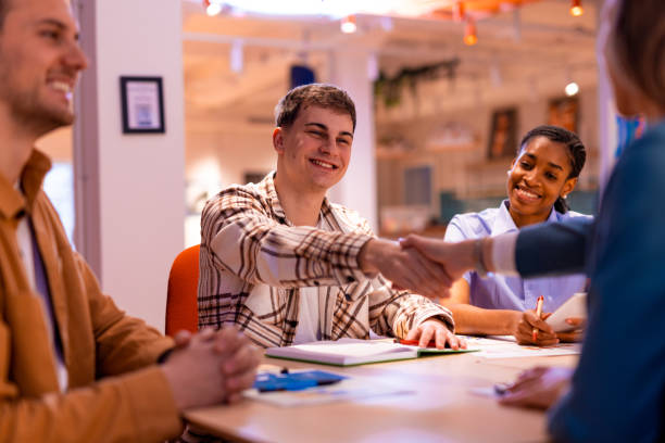 istock Young man shaking hands with a manager during a job interview 2196235624