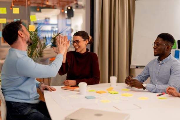 istock Business team giving high five after successful meeting 2196235725