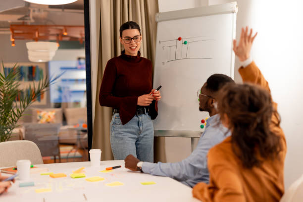 istock Young business team working together on a project in the office 2196235819