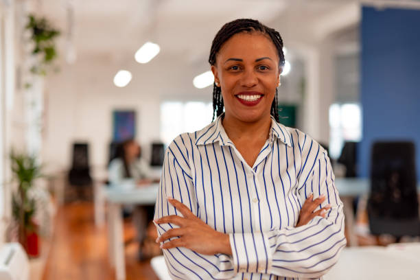 istock Confident Professional Woman Standing in Modern Office Environment 2196235897