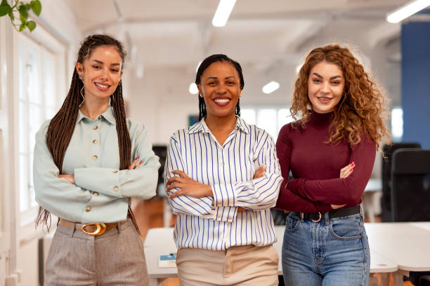 istock Confident Female Professionals Smiling in a Modern Office Background 2196236133