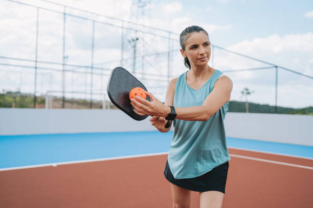 istock Woman playing pickleball 2196238358