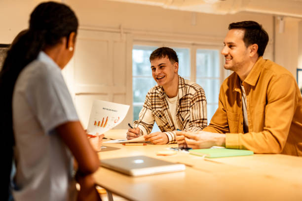 istock Marketing team analyzing data and discussing strategy during a meeting 2196238403