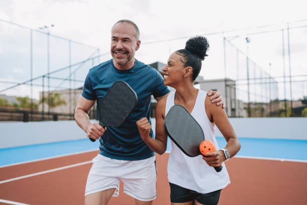 playing pickleball cheering when scoring a point stock photo