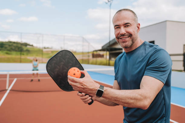 istock Group of people playing pickleball 2196238919