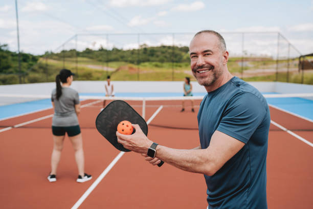 istock Group of people playing pickleball 2196238920