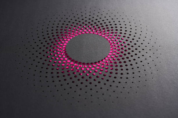istock Modern Paper Art with Pink Gradient Perforations in Circular Design on Dark Textured Background 2196238969