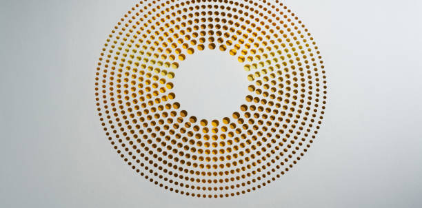 A minimalist paper artwork showcasing concentric perforations arranged in a circular gradient pattern. The colors transition from yellow to brown, creating a warm and balanced design against the clean white background, emphasizing precision and artistic elegance.\nNative image size: 10760 x 5304.