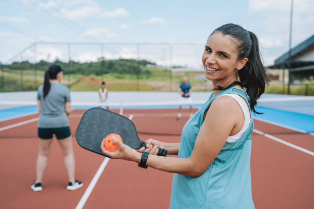 istock Group of people playing pickleball 2196239409