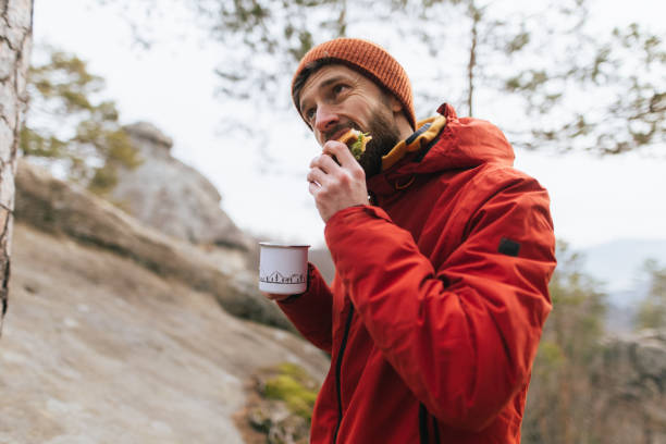 istock Hiker Enjoying a Sandwich Break in Nature 2196240263