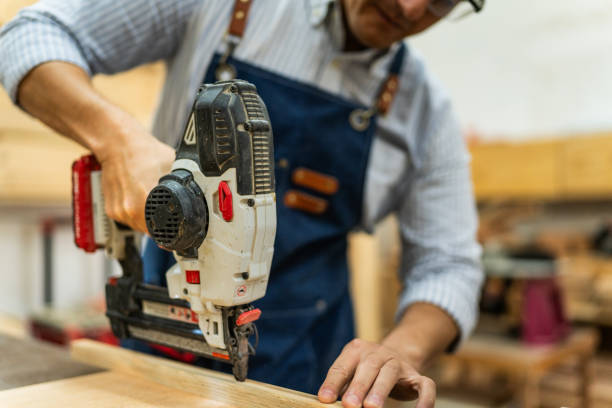 istock Close-up of a carpenter using nail gun in a carpentry 2196240294