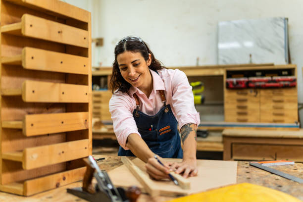 istock Mid adult carpenter woman working at carpentry 2196240766
