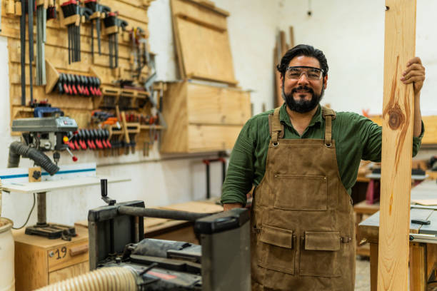 istock Portrait of mature carpenter man working a carpentry 2196240816