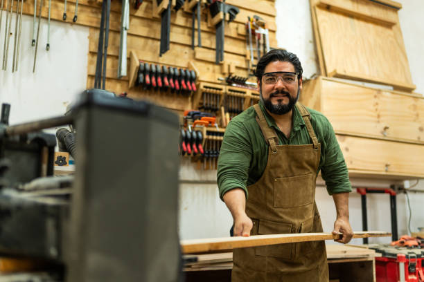 istock Portrait of mature carpenter man working a carpentry 2196240836
