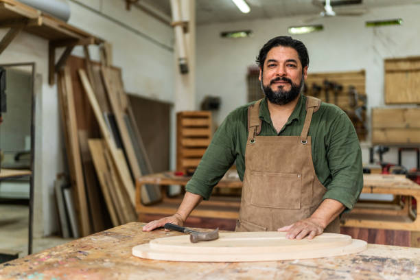 istock Portrait of mature carpenter man working at carpentry 2196240911